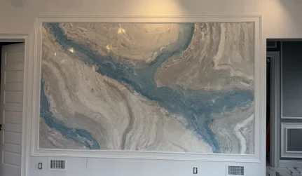 Custom decorative Venetian plaster wall finish with blue and grey marbled texture and gold highlights.